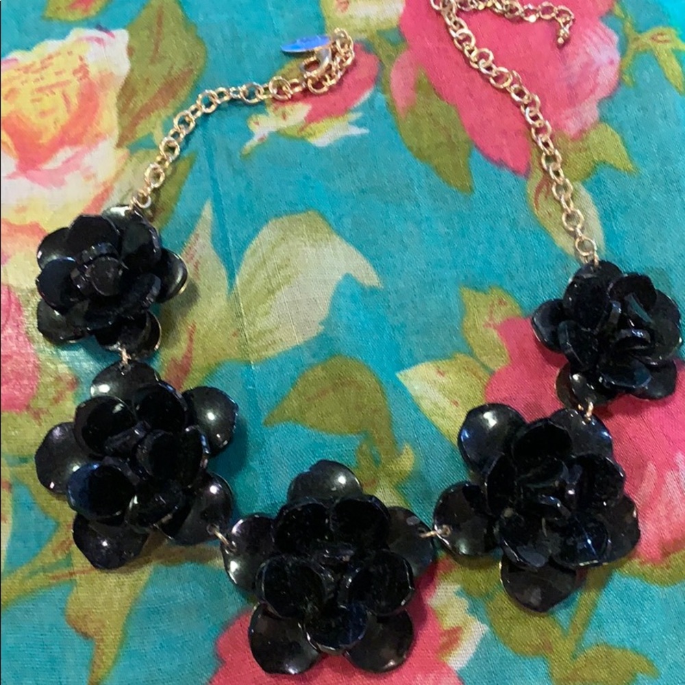 Black floral wreath necklace.